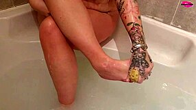 Seductive MILF Washes Feet While Teasing Ass and Boobs