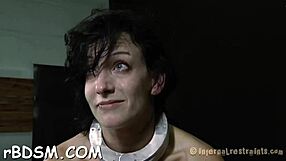 A brunette playgirl is handcuffed in the garage and punished with toys in a hardcore bdsm session