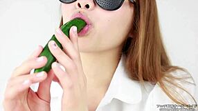 Asian women enjoy making sounds while eating cucumbers