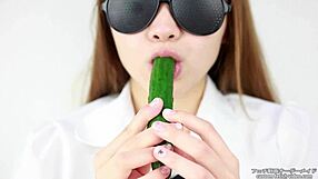 Asian women enjoy making sounds while eating cucumbers