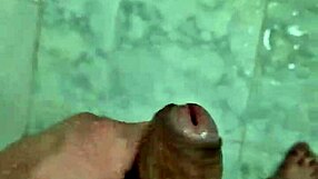 Hot young man showers and has fun in the bathroom