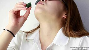 Asian women enjoy making sounds while eating cucumbers