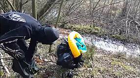 Why is this rich German femdom in rubber latex brutally dominating outdoors in the mud?