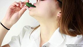 Asian women enjoy making sounds while eating cucumbers