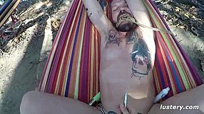 Couple enjoys kinky outdoor hammock activity