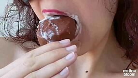 Watch Melina Bloom suck ice cream messily in slow motion, getting all wet and dirty?