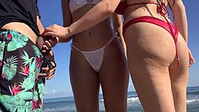two girls help me masturbate on beach