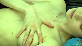 flexible ballerina teases with sensual poses on black leather sofa