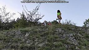 This brunette shows her nice tits naked on the street