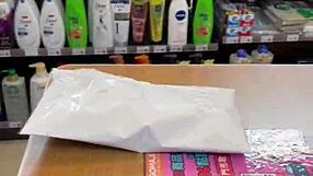 Asian ladyboy flaunts new thong in convenience store 😏