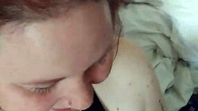 The redhead slut receives cum all over her tits from friend's big cock