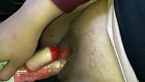 A crazy sexy Filipina masturbates with a dildo while driving a car