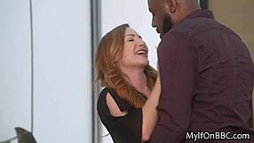 A red-haired wife with big tits gets a big black cock