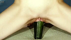 Wow, she's going hard with a big zucchini for solo masturbation!