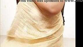 chubby asian aunty teasingly shows her big boobs