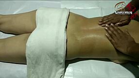 Indian lady receives full body massage in homemade setting close up