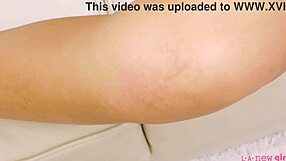 Sizzling brunette naked close-up photoshoot on sofa.