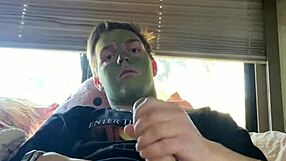 Fit guy strokes his cock while doing skin care routine