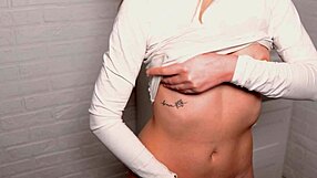 a young beauty caresses her wet pussy to orgasm close up.