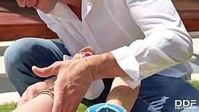 Karlie Simons gets foot fucked under the sun.