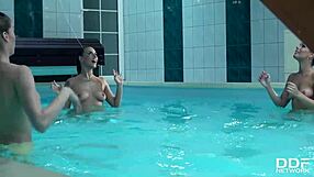 Three stunning bombshells share one cock in the pool.