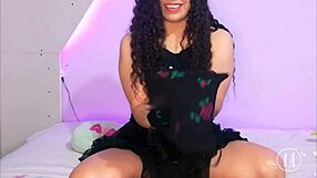 A lingerie-clad beauty tries out a new robe and her bulge is hard to ignore