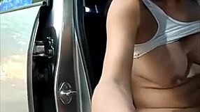 Horny ladyboy pees and strokes her big cock while sitting in the car.