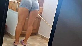 The maid wears tight shorts while cleaning the house