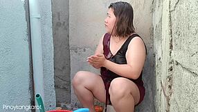 Filipina bathing outside gets fucked by not son daddy.
