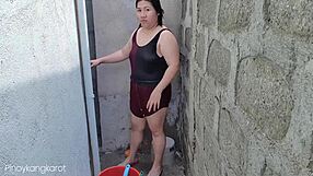 Filipina bathing outside gets fucked by not son daddy.