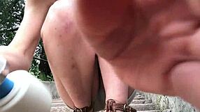 redhead stuffs undies and squirts outdoors!