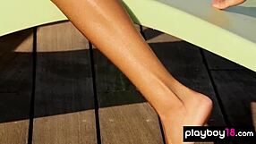 All-natural ebony babe teasing with a slow strip by the pool