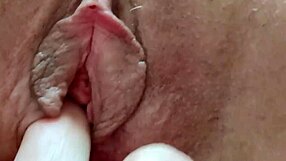 Close-up of a latina mature slut rubbing her clit and wet pussy for orgasm.