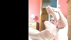 Shemale in stockings provocatively showing off her big cock, teasing with every move