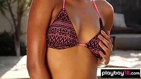 All-natural ebony babe teasing with a slow strip by the pool