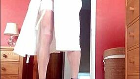 Shemale in stockings provocatively showing off her big cock, teasing with every move