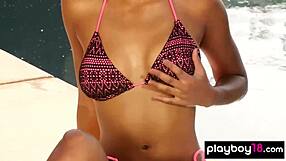 All-natural ebony babe teasing with a slow strip by the pool