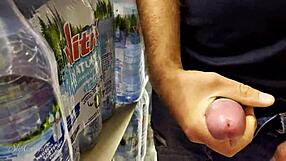 Helping this guy cum in supermarket with handjob on big cock