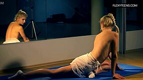 Amateur performs flexible yoga dance in white dress at gym