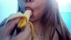 seductive asian girl sucks banana deepthroat in fantasy food play