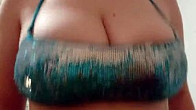 Depravedminx in bikini with breasts exposed at beach