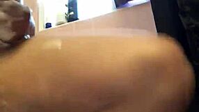 She's shaving her hairy bush in the shower.