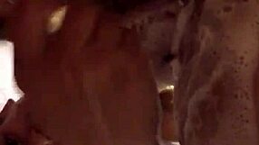 She's shaving her hairy bush in the shower.