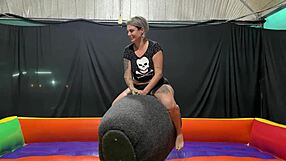 Latina pornstar rides mechanical bull then gets squirted on public street