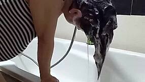 Voyeur camera catches nude Regina Noir in the shower. She washes her hair with sensual moves.