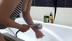 Voyeur camera catches nude Regina Noir in the shower. She washes her hair with sensual moves.