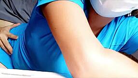 Nurse bends over for patient in hospital