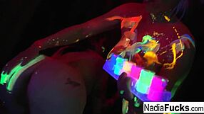 Beautiful black babes suck and lick a colorful cock