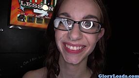 Hey, watch this petite babe with glasses sucking at gloryhole.