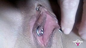 Kinky mother fingers and fists her pierced pussy.